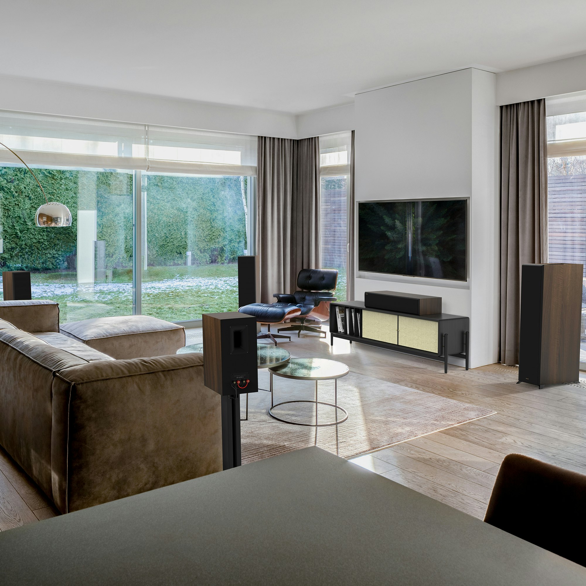 Reference Premiere II Series Home Theater Speakers with a walnut finish in a living room setting with brown furniture